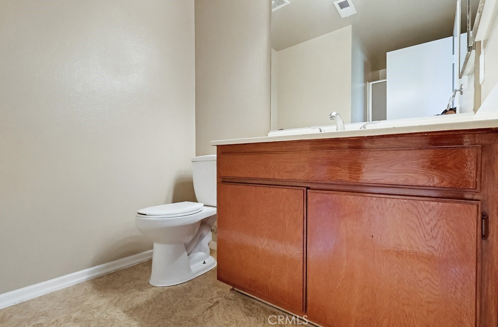 19018 Sherman Way, Unit 110 Reseda, CA 91335 - Photo 35 of 68 a white toilet sitting next to a shower