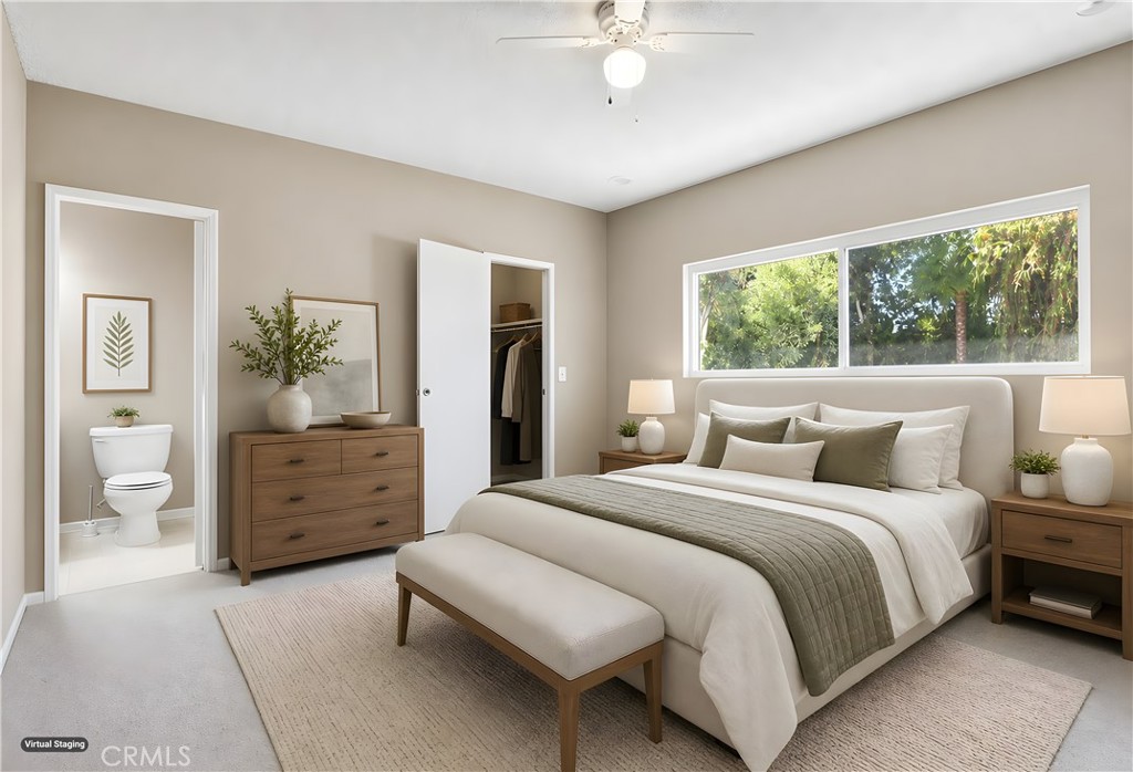 19018 Sherman Way, Unit 110 Reseda, CA 91335 - Photo 42 of 68 a bedroom with a large bed and a chandelier