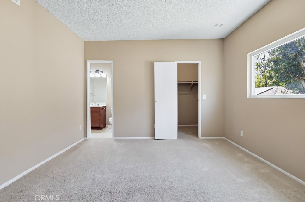 19018 Sherman Way, Unit 110 Reseda, CA 91335 - Photo 43 of 68 an empty room with windows and closet
