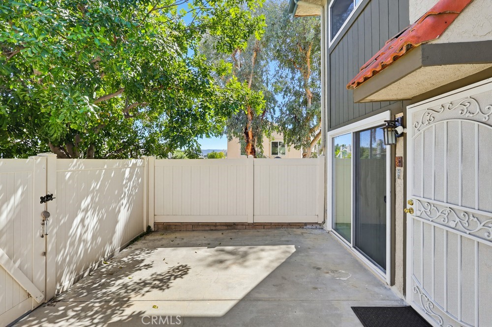 19018 Sherman Way, Unit 110 Reseda, CA 91335 - Photo 5 of 68 a view of a house with a wooden fence