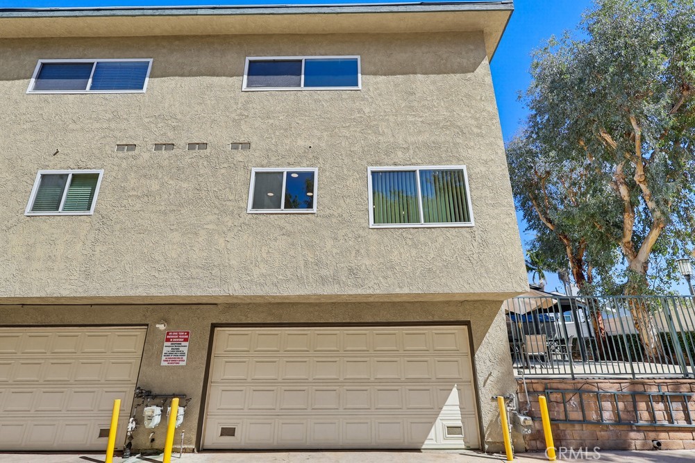 19018 Sherman Way, Unit 110 Reseda, CA 91335 - Photo 62 of 68 a front view of a house with large windows