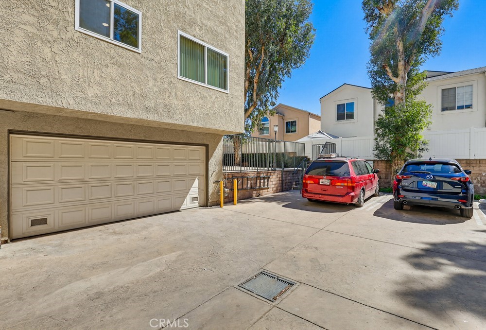 19018 Sherman Way, Unit 110 Reseda, CA 91335 - Photo 64 of 68 a car parked in front of a house