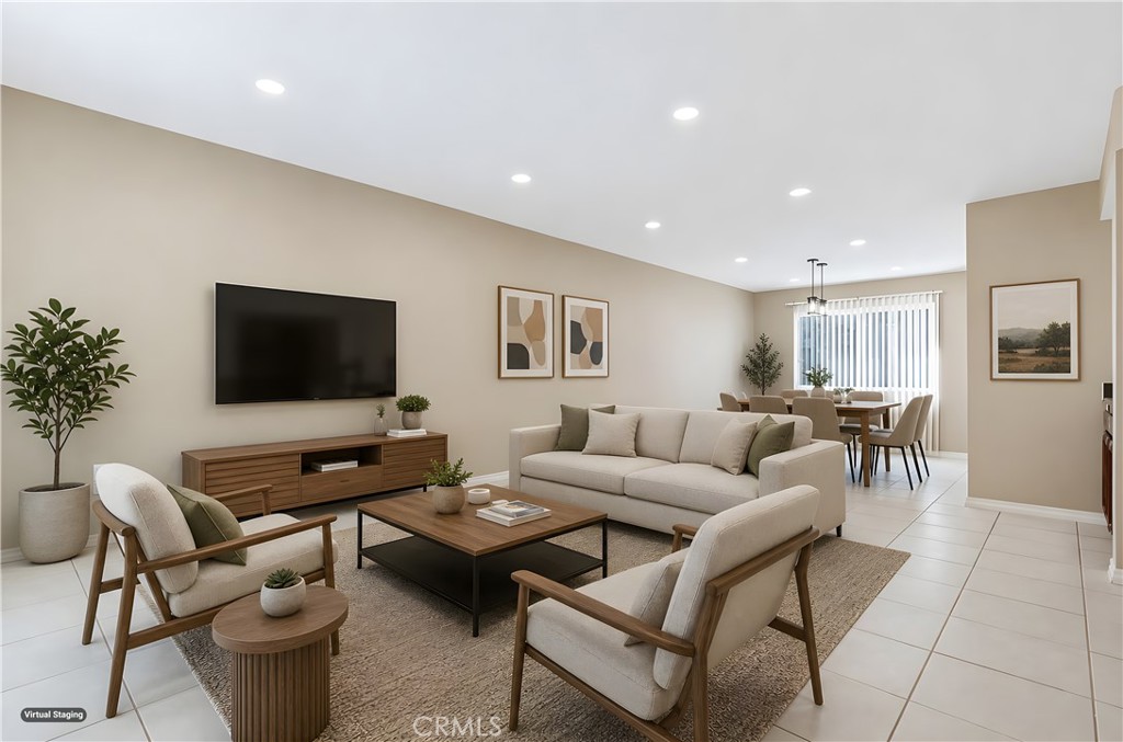 19018 Sherman Way, Unit 110 Reseda, CA 91335 - Photo 8 of 68 a living room with furniture a flat screen tv and a dining table
