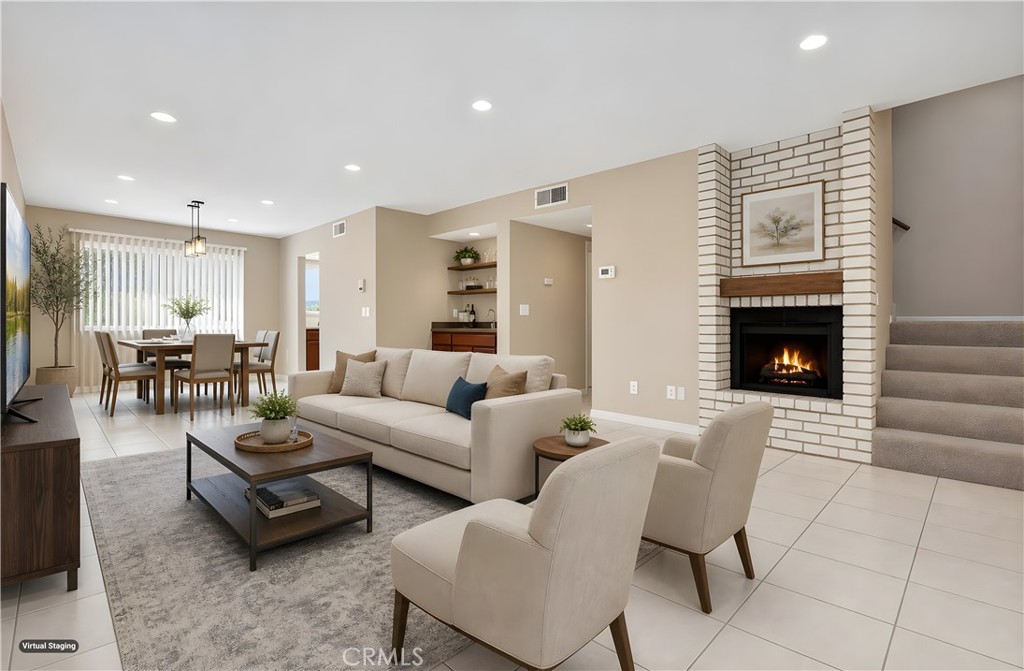 19018 Sherman Way, Unit 110 Reseda, CA 91335 - Photo 10 of 68 a living room with furniture and a fireplace
