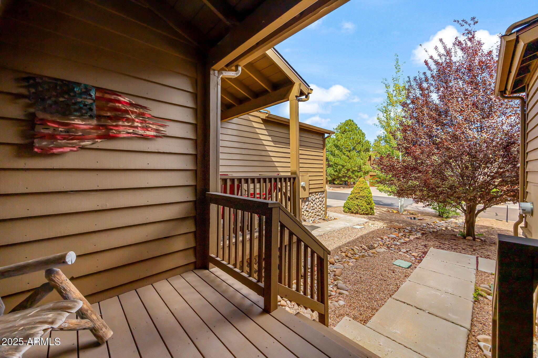 6935 Starlight Ridge Road Lakeside, AZ 85929 - Photo 5 of 33 a view of a porch with wooden floor and iron fence