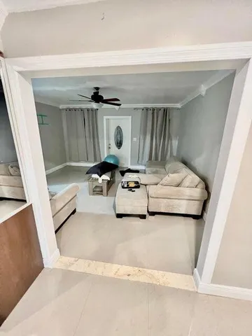 a view of bedroom with furniture and a window