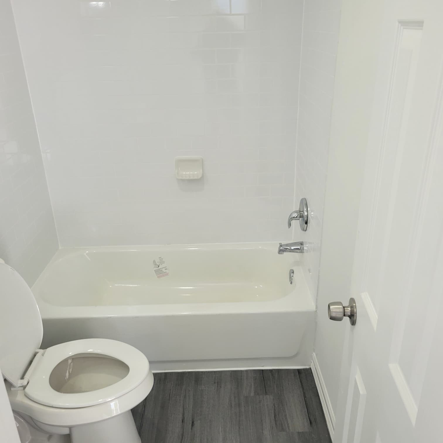 4312 Crane Street, Unit 11 Houston, TX 77026 - Photo 13 of 13 a bathroom with a toilet and a bathtub