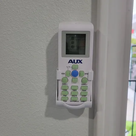a living room with window and mirror