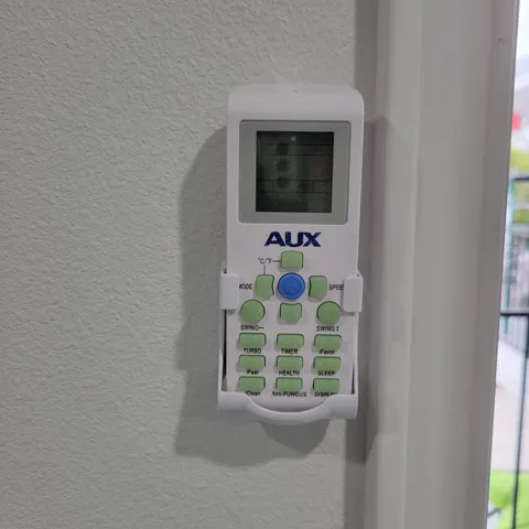 a living room with window and mirror
