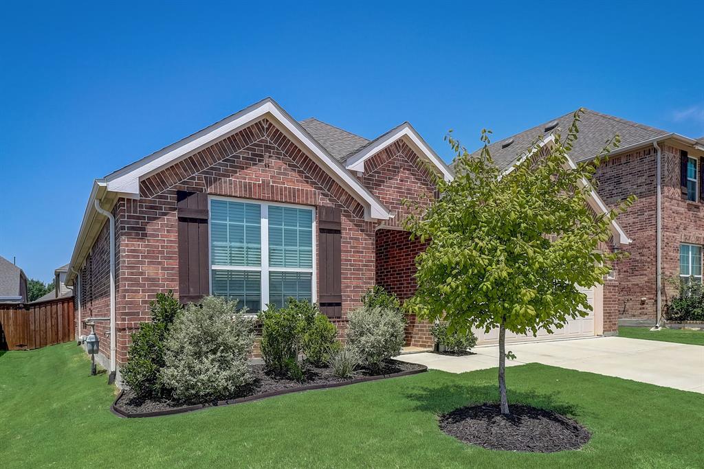 5817 Brightfield Road Fort Worth, TX 76137 - Photo 1 of 1 a front view of a house with a yard