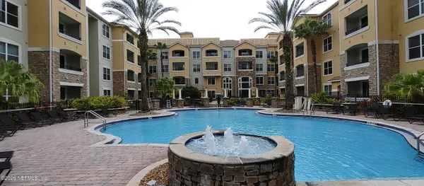 a view of a swimming pool with a patio