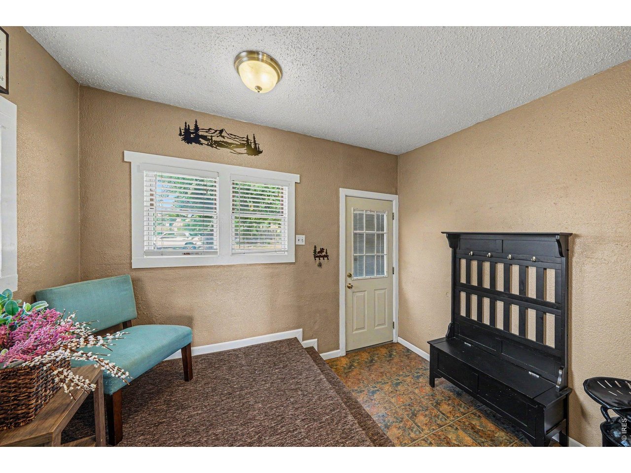 1430 30th Street Road Greeley, CO 80631 - Photo 9 of 22 a living room with furniture and a window