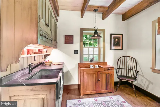a living room with furniture and a book shelf