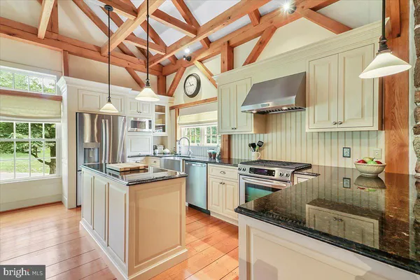 a kitchen with a stove and a microwave