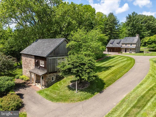 a view of a house with backyard sitting area and garden