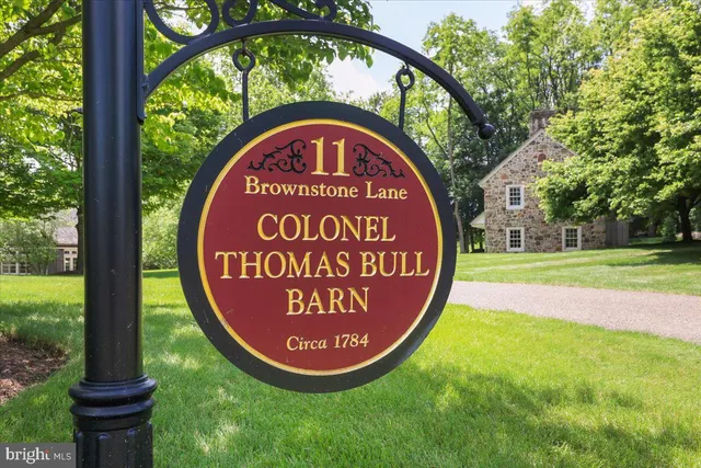 a view of a backyard with plants and outdoor seating