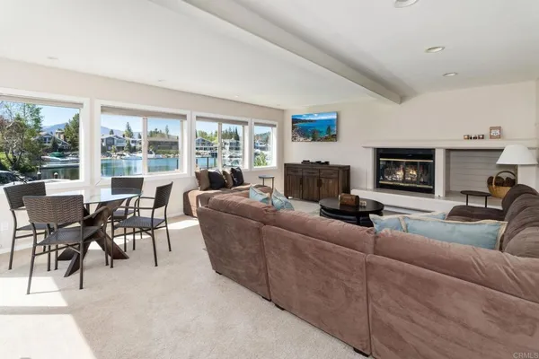 a view of balcony with wooden floor and lake view