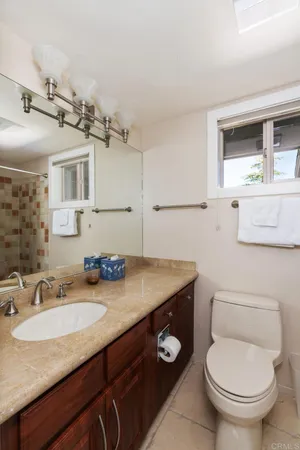 a view of a porch with wooden floor and garden