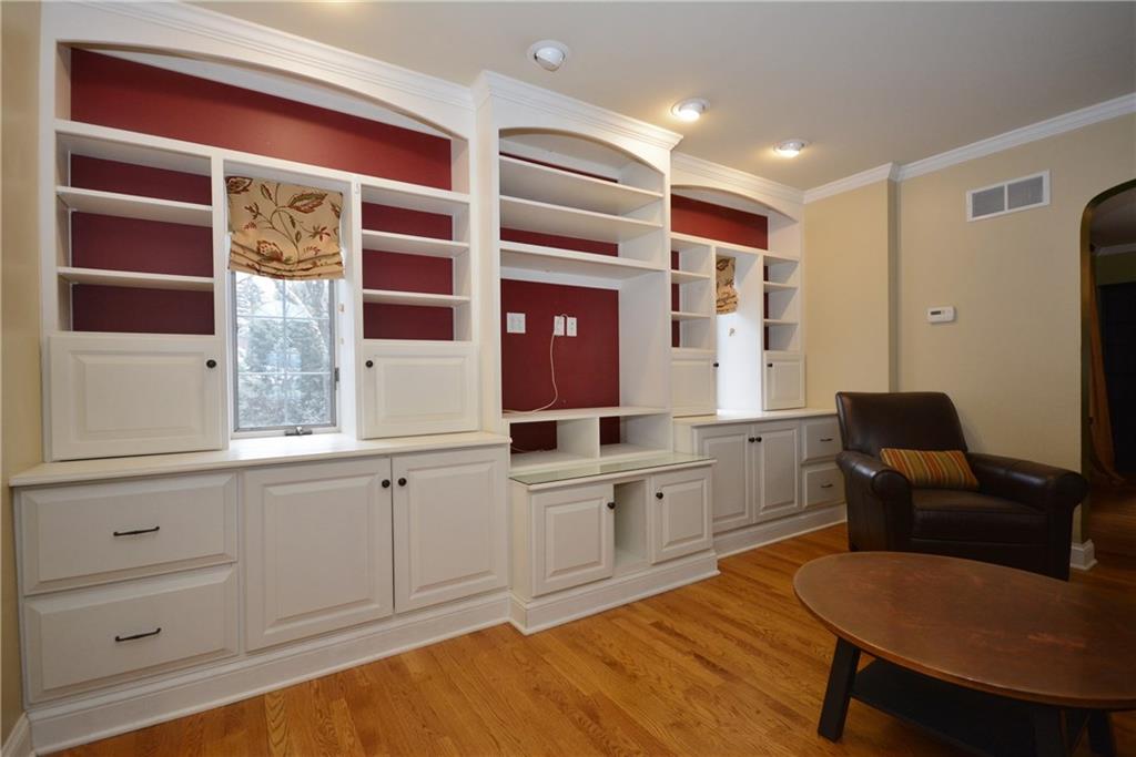 308 Bevington Road Forest Hills, PA 15221 - Photo 11 of 25 Family room addition includes custom media/bookcase built-ins. All custom window treatments are included.