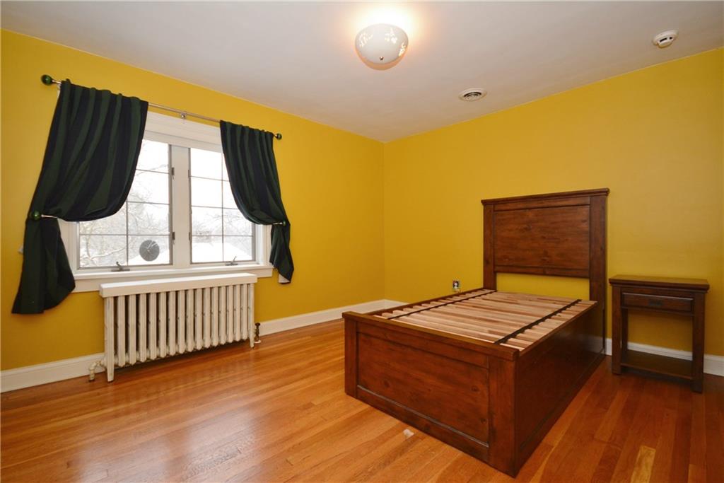 308 Bevington Road Forest Hills, PA 15221 - Photo 22 of 25 Third full bedroom off the common room has hardwood floors, plenty of closet space and includes window treatments.