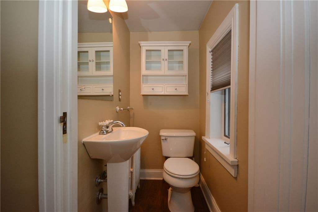 308 Bevington Road Forest Hills, PA 15221 - Photo 4 of 25 Two piece powder room on landing by front entrance. Include window treatments and freshly painted.
