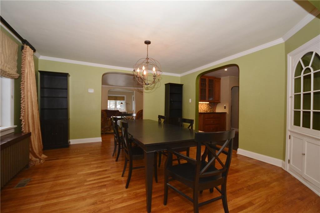 308 Bevington Road Forest Hills, PA 15221 - Photo 7 of 25 Expansive dining room with direct access to living room, kitchen and family room. Contemporary light fixture, original built in and custom window treatments are included.