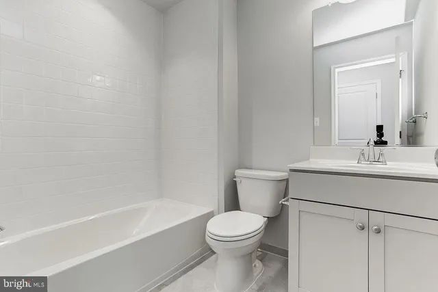 a bathroom with a sink toilet and bathtub
