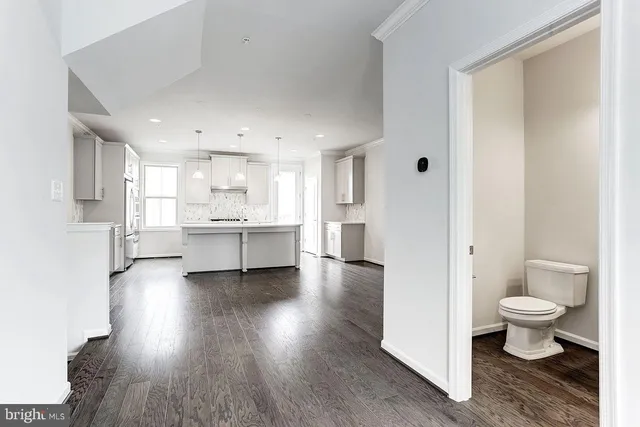 a view of kitchen and wooden floor