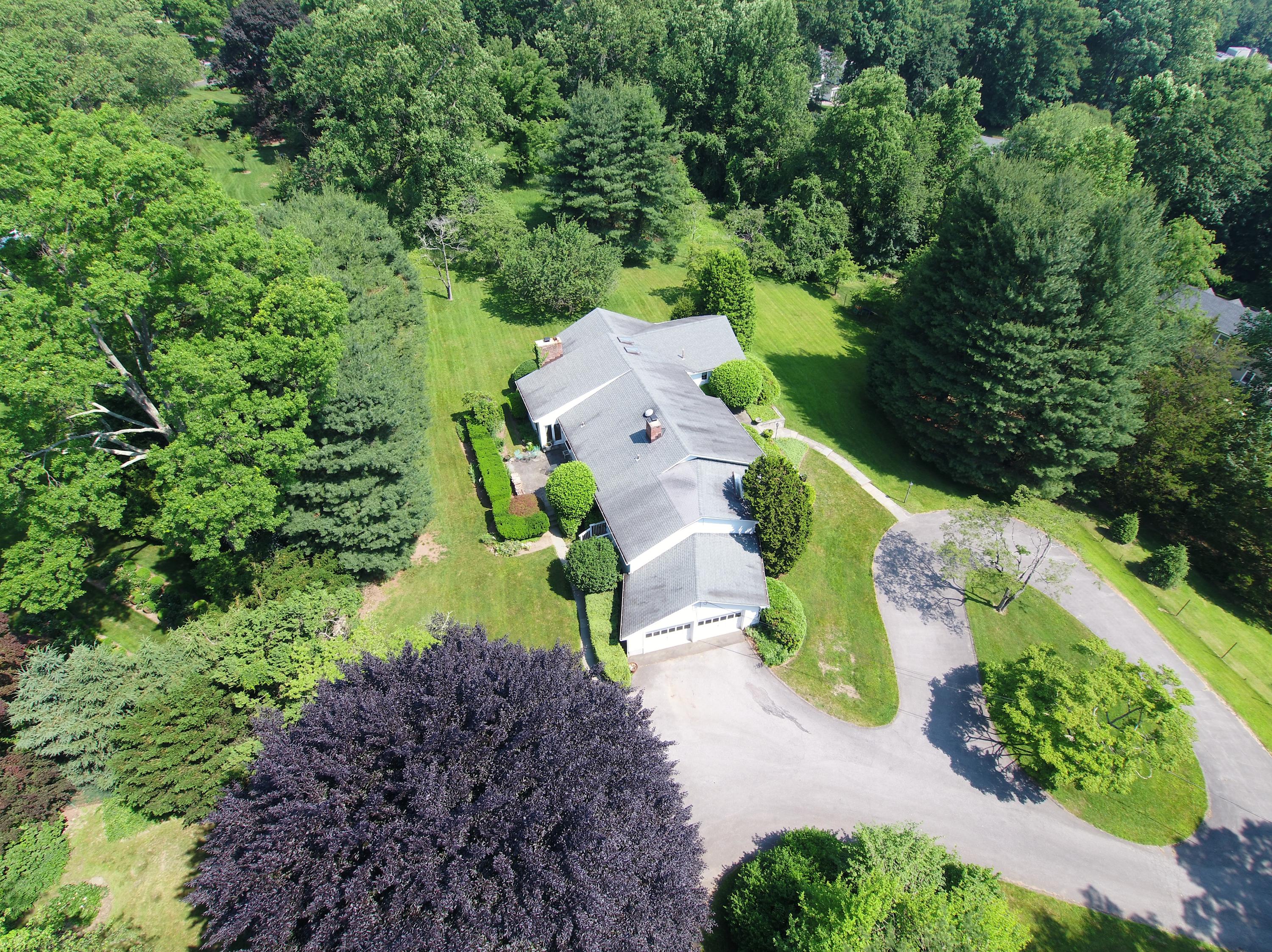 65 Maywood Road Darien, CT 06820 - Photo 4 of 14 an aerial view of a house with a yard