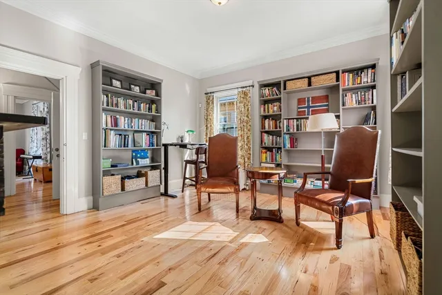 a view of staircase with wooden floor and white walls