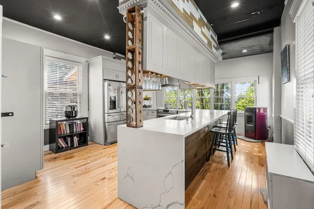 a kitchen with cabinets and stainless steel appliances