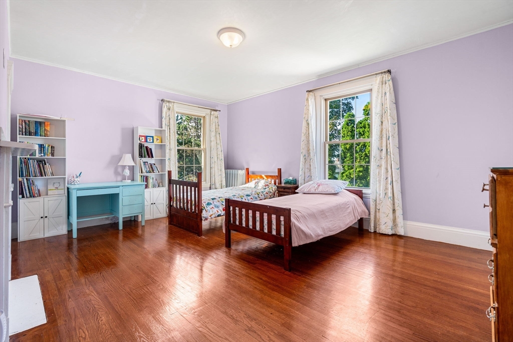 33 Middle Street Gloucester, MA 01930 - Photo 26 of 42 a bed room with a bed and a chair