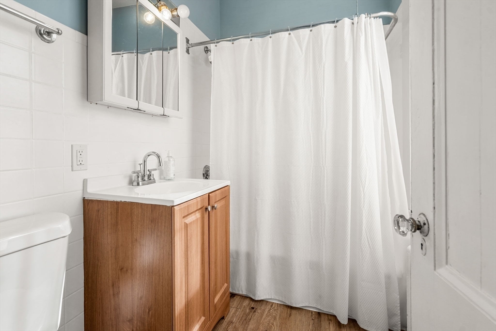 33 Middle Street Gloucester, MA 01930 - Photo 28 of 42 a bathroom with a sink and a mirror