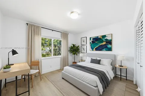 a bedroom with a bed and a table