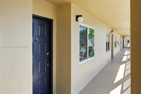 a view of a hallway with windows