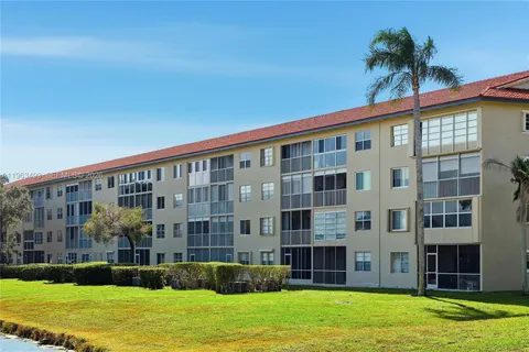 a view of a swimming pool with an ocean and mountain view