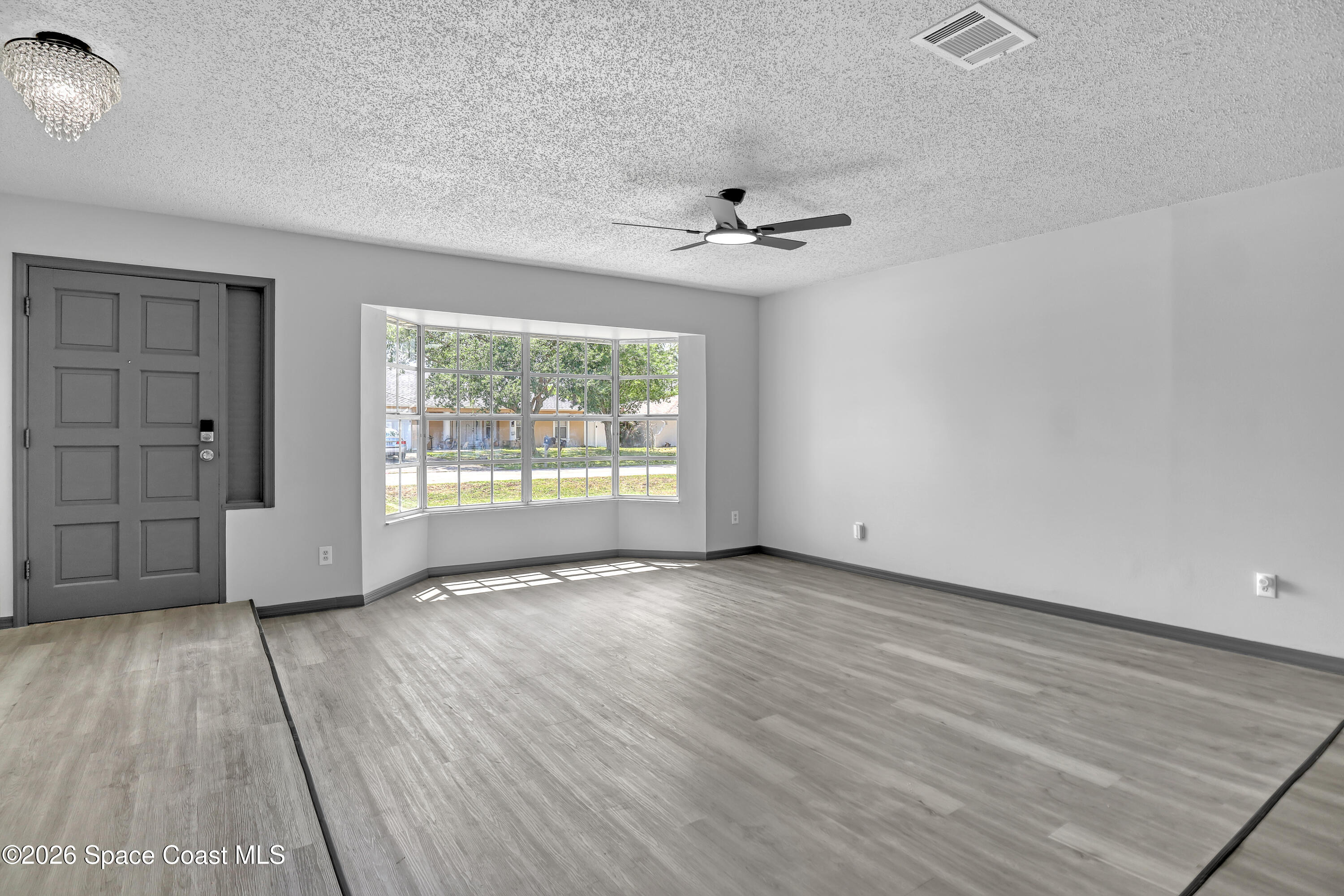 999 Castile Road Southeast Palm Bay, FL 32909 - Photo 8 of 45 Same Living Room