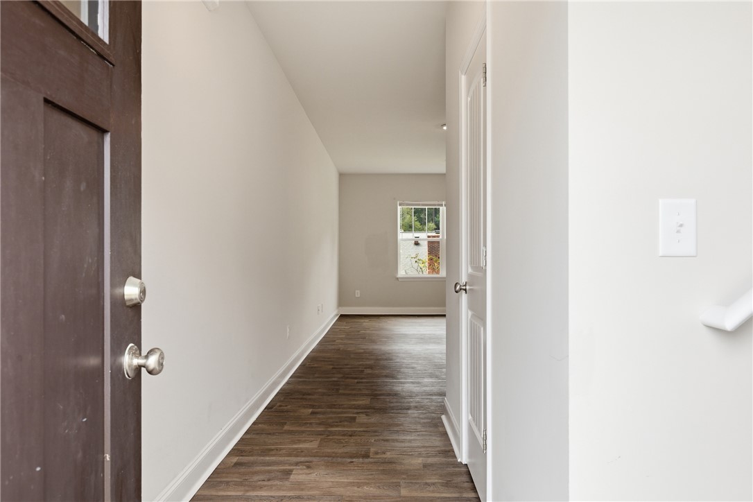 116 Ventura Street Anderson, SC 29621 - Photo 3 of 27 A welcoming entryway transitions smoothly into the open-concept living space via rich wood-look flooring.