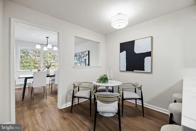 a kitchen with a sink cabinets and wooden floor