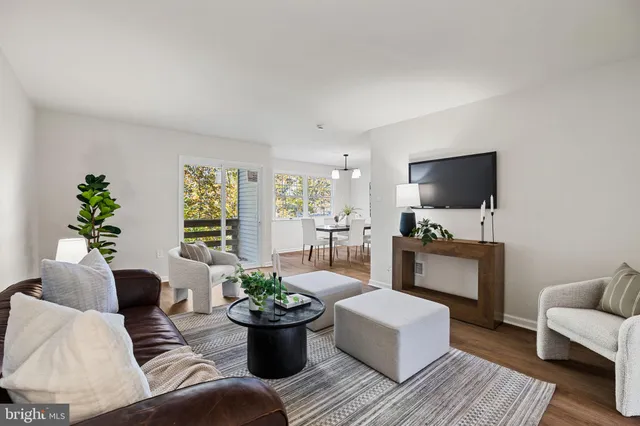 a view of an empty room with a chandelier
