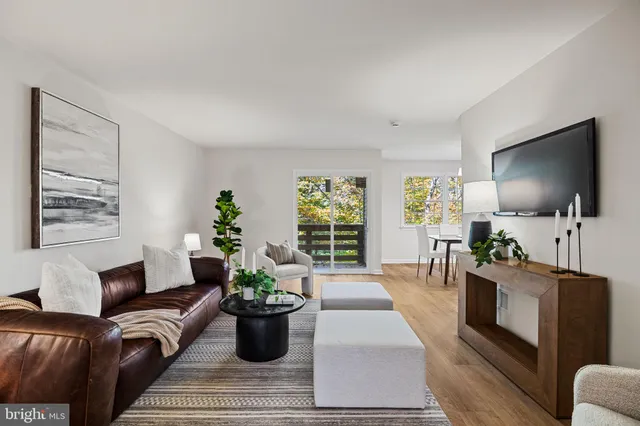 a bedroom with a bed a mirror and a window