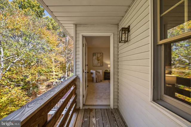 a view of a livingroom with furniture and a mirror