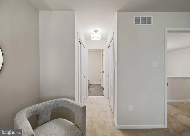 a view of a livingroom with furniture and a window