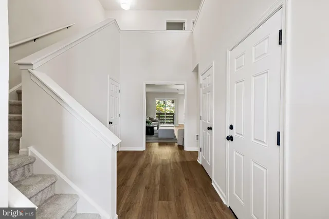 a bathroom with a toilet and a hardwood