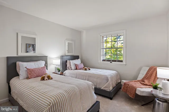 a view of wooden floor in an empty room with a window