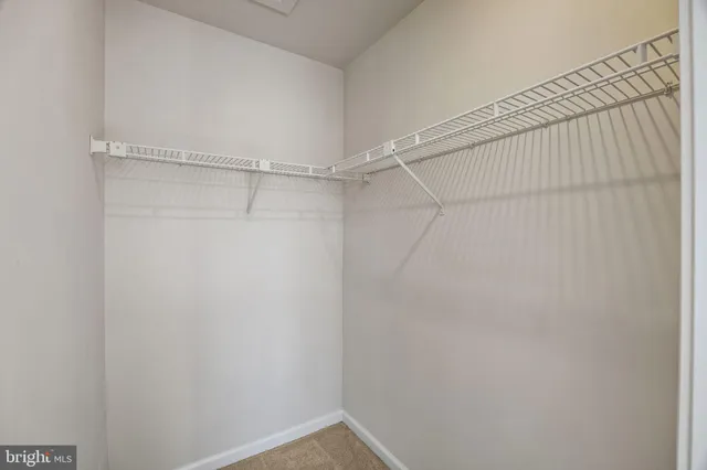 a view of a garage with wooden fence