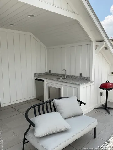 a living room with furniture and a rug
