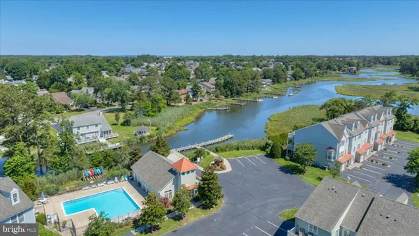 an aerial view of a house with a lake view