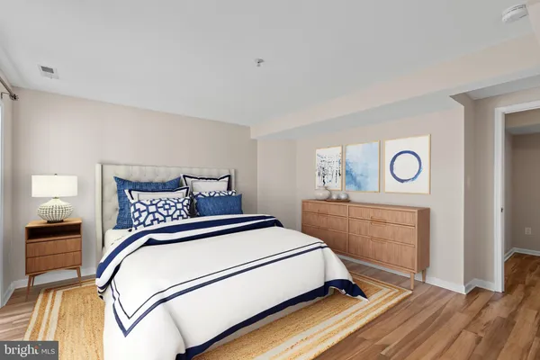 a bedroom with a bed and a dresser