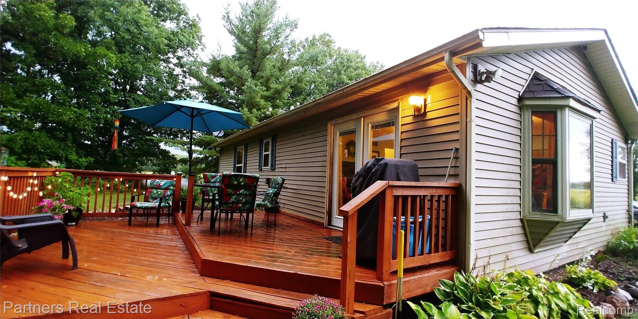 7451 Sanford Road Howell, MI 48855 - Photo 6 of 30 Large 2-level deck is perfect for entertaining family and friends, or just to enjoy all to yourself.